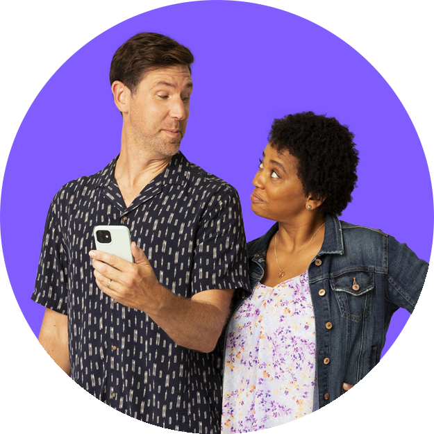 Man and woman looking at each other man holds phone