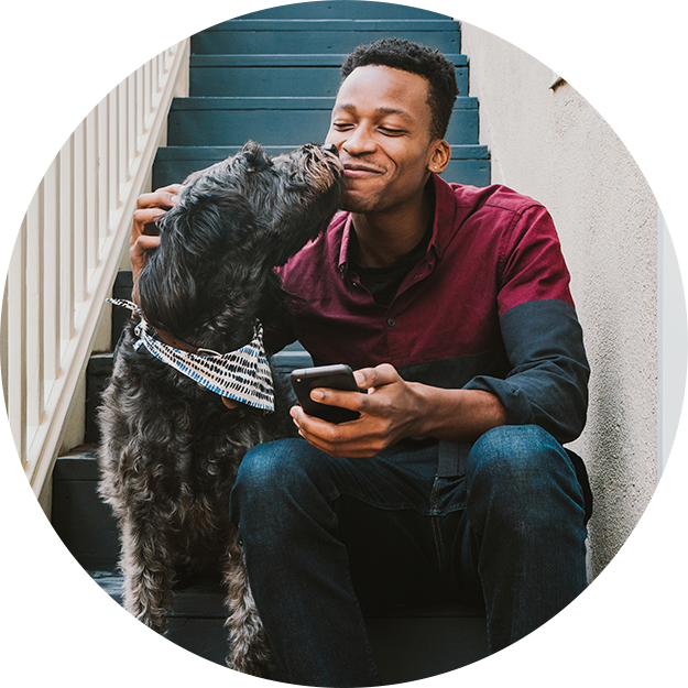 Man sits on stairs with dog
