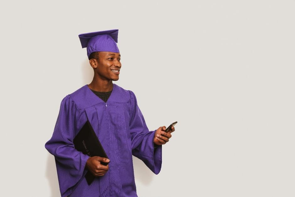 Boy in graduation cap and gown