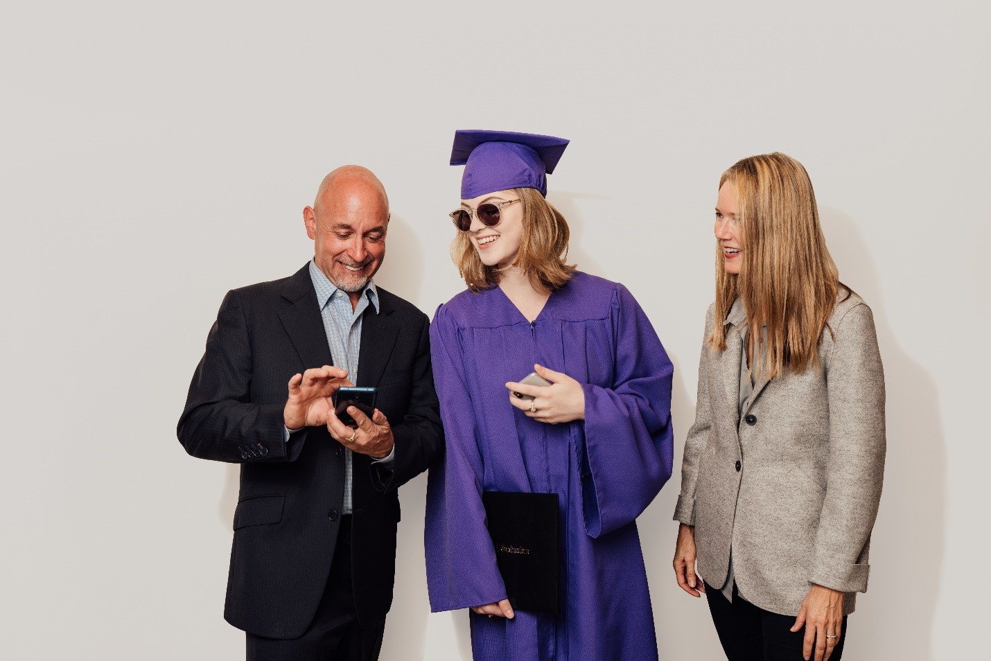 Daughter with parents at graduation
