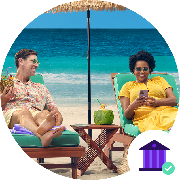 man and woman sitting on the beach in beach chairs